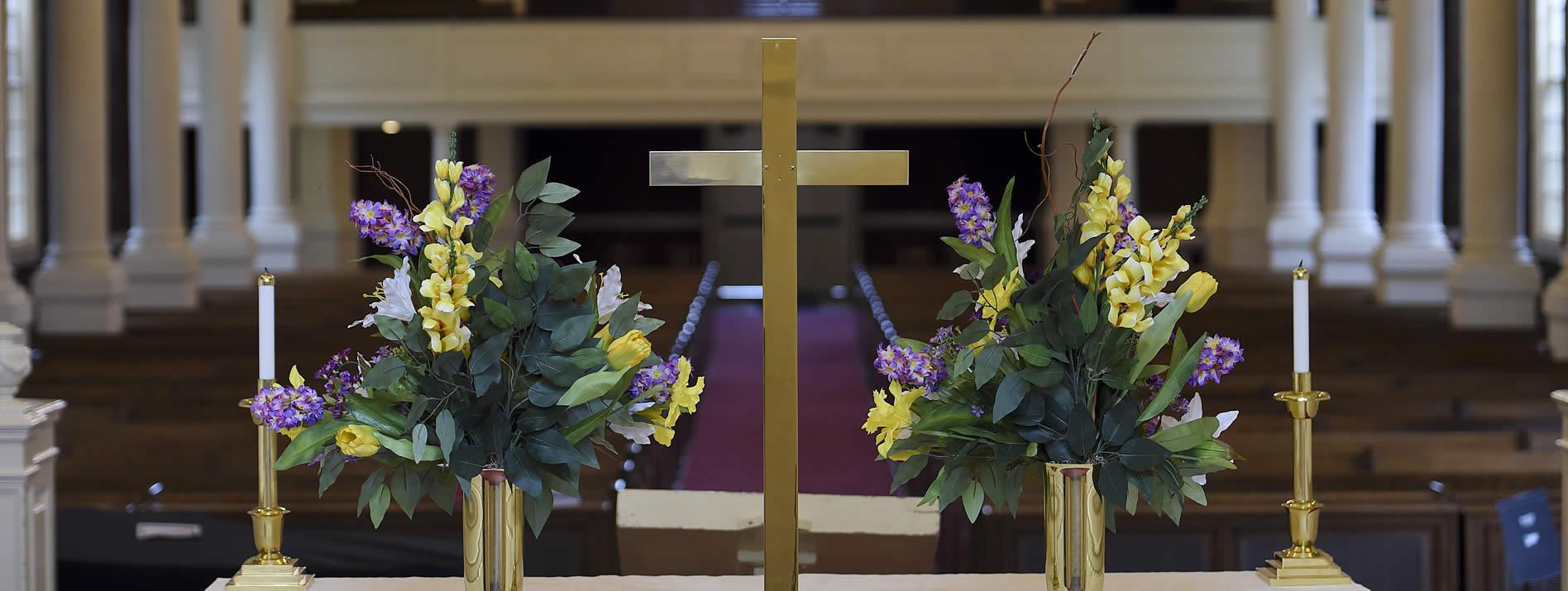 Church altar with purple and yellow flowers